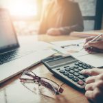 Man looking at stock position size calculator